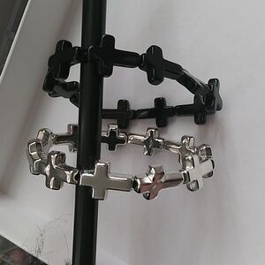 New. Set Of 2 Silver and Black Stretchy Cross Bracelets.